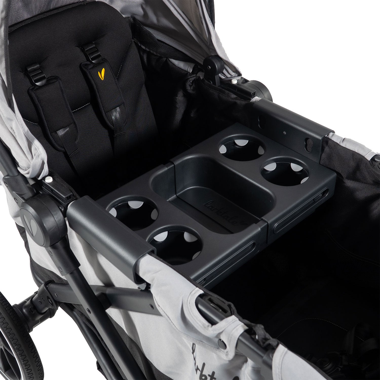 grey two seater stroller wagon showing the snack tray fit a narrow wagon frame